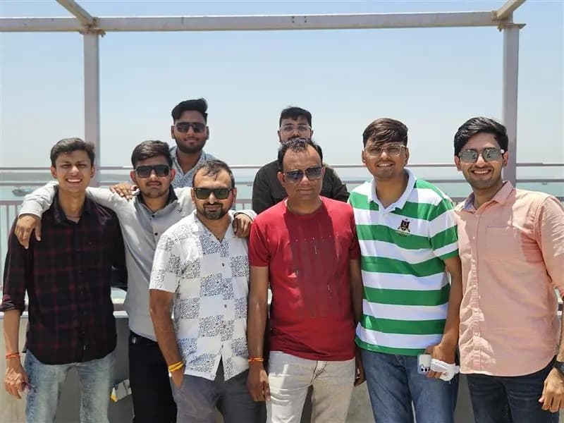 Colleagues gathered on the office terrace on a sunny day